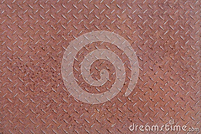 A rusty checker plate patterned background Stock Photo