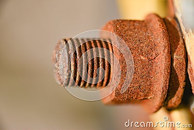 Rusty connecting bolt with nut, old abandoned metal element Stock Photo