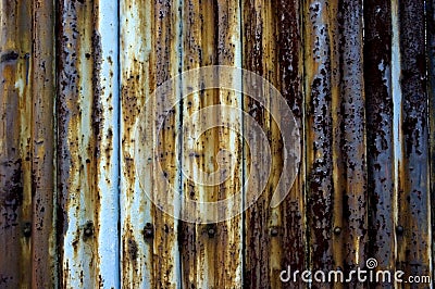 Rusty corrugated steel fence. Stock Photo