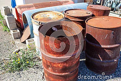 Rusty and damaged steel drums Stock Photo