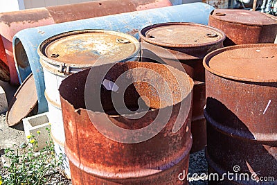 Rusty and damaged steel drums Stock Photo