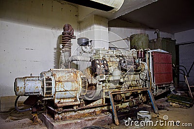 Rusty diesel generator in an abandoned Soviet bomb shelter Stock Photo