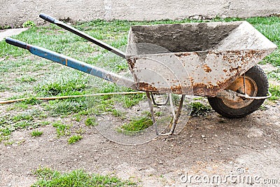 Rusty and dirty wheelbarrow Stock Photo