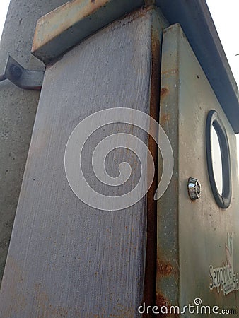 rusty electrical box stuck to the poleï¿¼ Editorial Stock Photo