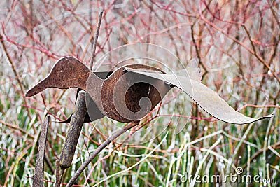 Rusty Goose Statue in Garden Stock Photo