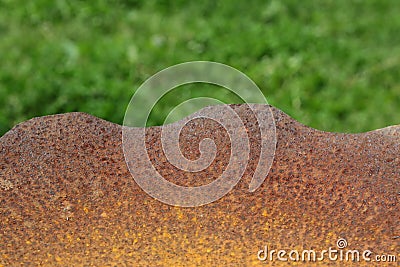 Rusty grill over blurred grass background Stock Photo