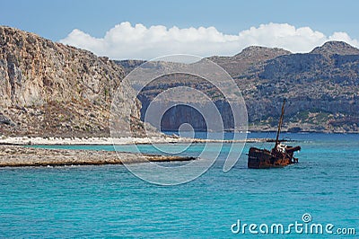 Rusty half-sunken ship Stock Photo