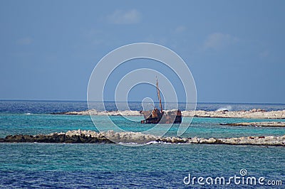 Rusty half-sunken ship Stock Photo