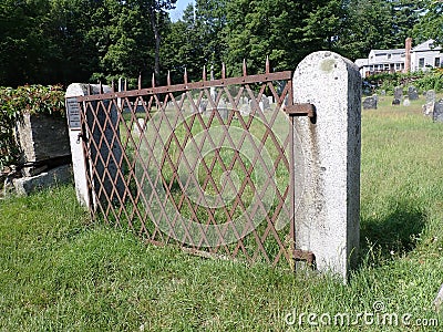 Rusty iron fence guarding the old burial ground of 1745-1791 Boylston, Ma Editorial Stock Photo