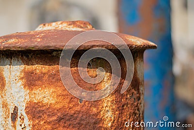 Rusty Iron Finials on Old Fence with Flaking Blue Paint Stock Photo