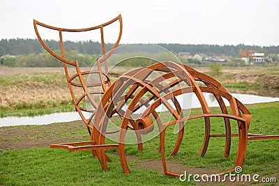 Rusty iron monument to a whale fish on the city riverfront / promenade Editorial Stock Photo