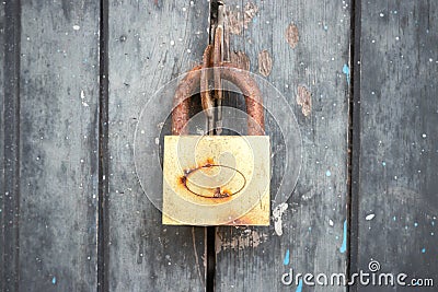 The Rusty lock with wood door, Old lock close home door Stock Photo