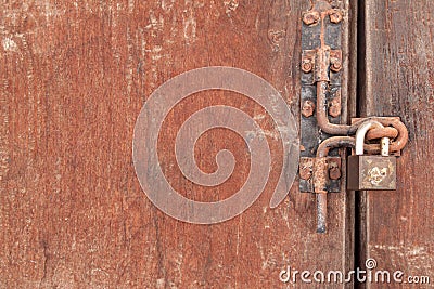 The Rusty lock with wood door Stock Photo