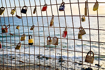 Rusty love locks hanging on the fence as a symbol of loyalty and Editorial Stock Photo