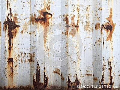 Rusty metal background with old layers of white paint. Texture rusted shipping container. Stock Photo