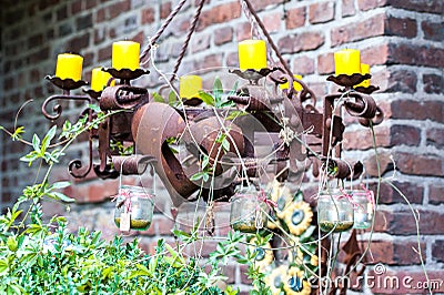 Rusty metal candle holder with chains Stock Photo