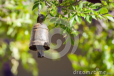 Rusty metal ritual bell. Stock Photo