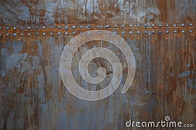 Rusty metal with rivets Stock Photo