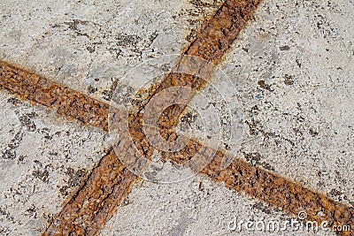 Rusty metal structure in a concrete slab Stock Photo