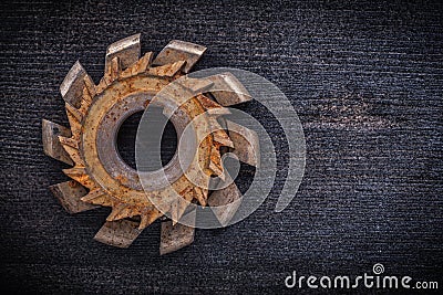 Rusty obsolete cutting tool on wooden board Stock Photo