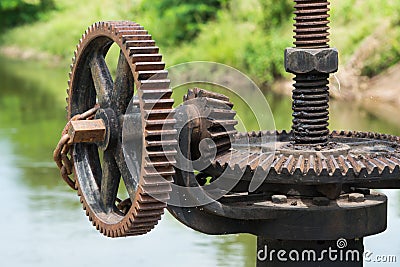 Rusty and oily water gate gear. Stock Photo