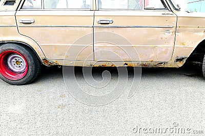 Rusty old car with rear wide wheels in the style of drift. Stock Photo