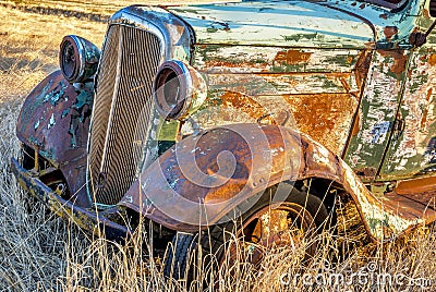 Rusty old forgotten truck in a wheat field Stock Photo