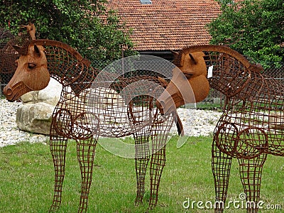 Rusty and old metallic horse statues in the garden Editorial Stock Photo