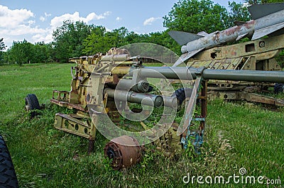 Rusty and old remnants of an artillery installation in the war fields Stock Photo