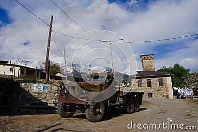 A rusty old Russian truck parked in the village of Mestia, Georgia Stock Photo