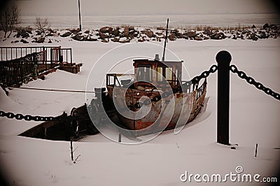 Rusty old ship under the open sky in winter Stock Photo