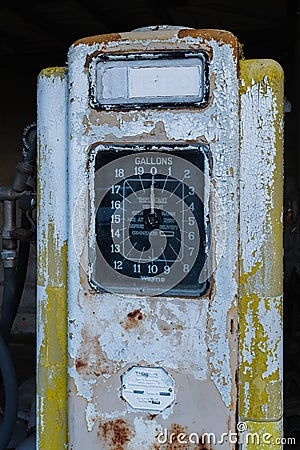 A rusty old yellow petrol pump Editorial Stock Photo