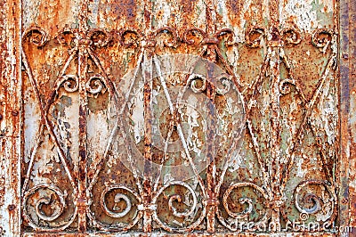 Rusty ornamental iron fence background Stock Photo