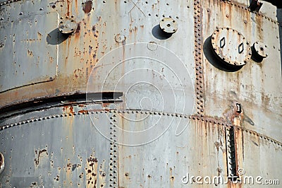 Rusty riveted steel plates Stock Photo