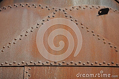 Rusty riveted steel plates Stock Photo