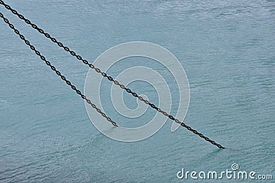 Rusty ship chain submerged in sea water Stock Photo