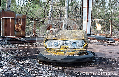 Rusty small children cars in abandoned amusement park in Pripyat, Chernobyl exclusion zone Stock Photo