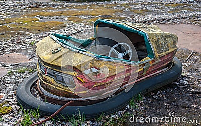 Rusty small children cars in abandoned amusement park in Pripyat, Chernobyl exclusion zone Stock Photo