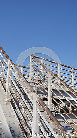 Rusty staircase and overhead crossing Stock Photo