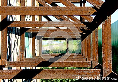 Rusty steel recurrent rectangular constructions welded together Stock Photo