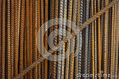 Rusty steel rods. Material for the construction of buildings and houses. Strong metallic material forming a repeating pattern Stock Photo
