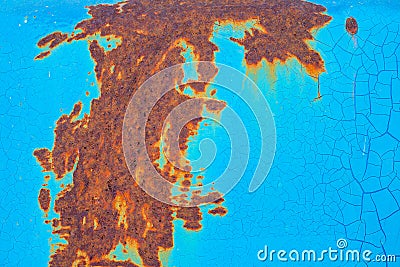 Rusty surface of metal plate with blue cracked color paint. Rust on old colored metal. Stock Photo