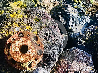 Rusty texture on circle steel surface. Old matel on rock. Stock Photo