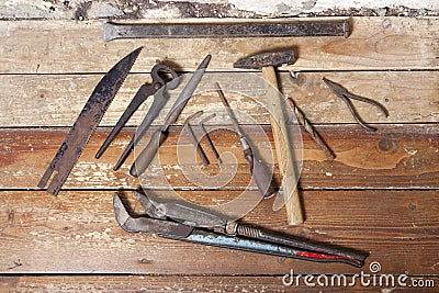 Rusty tools on wooden flooring Stock Photo