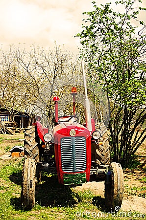 Rusty tractor in countryside Stock Photo