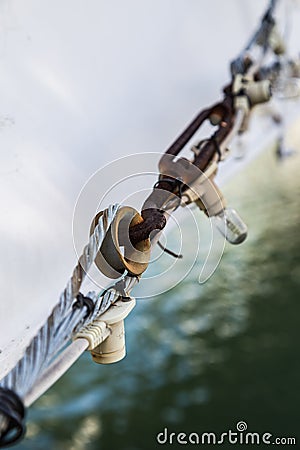 Rusty Turnbuckle attached to wire rope Stock Photo
