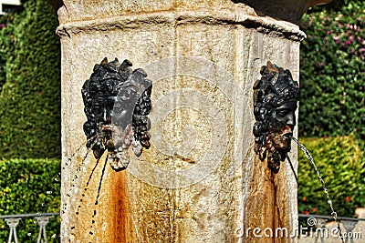 Rusty fountain in a garden in Valencia Stock Photo