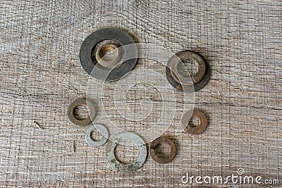 Rusty Washer Happy Face Conceptual Art on Grey Timber Stock Photo