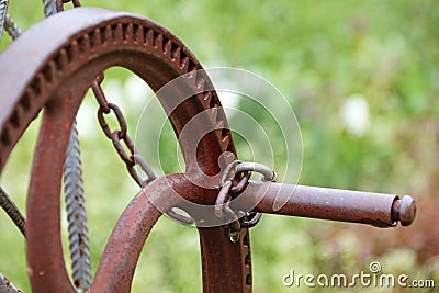 Rusty crank locked with a chain Stock Photo