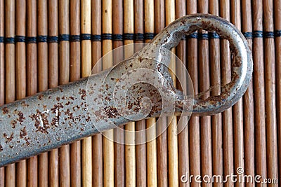 Rusty Wrench craftsman tool on wooden table, Spanner Tools collection, vintage style. Stock Photo